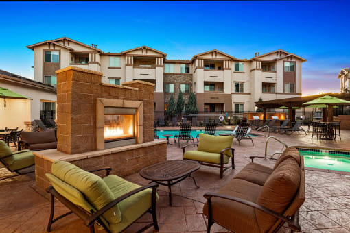 First and Main Apartments poolside fireplace lounge