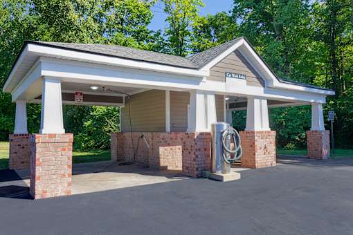 A covered parking area with a sign that says "Walden".