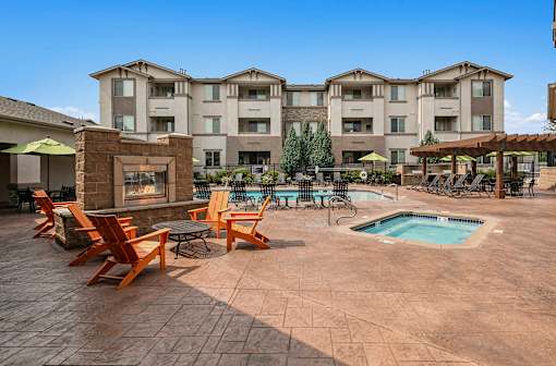 Poolside heated spa and fireplace lounge - First and Main Apartments