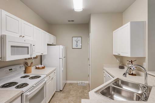 White appliances in select units - Lantern Woods Apartments