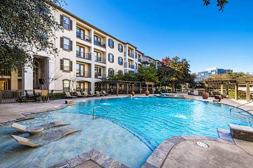 Resort-style pool with sun deck - Monterra Las Colinas Apartments