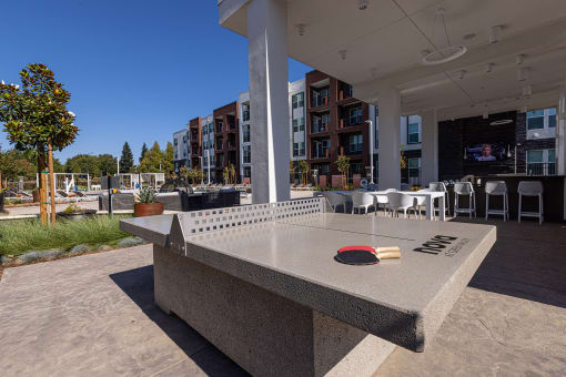 Outdoor games including ping pong - NOVA at Green Valley