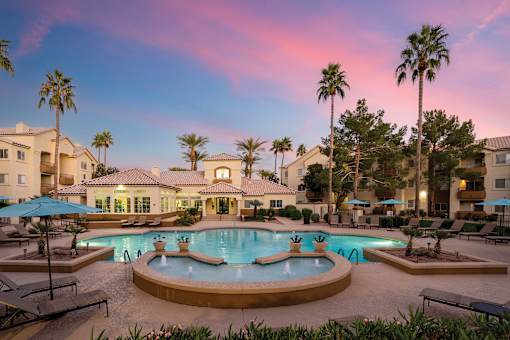 A large house with a pool in the backyard.
