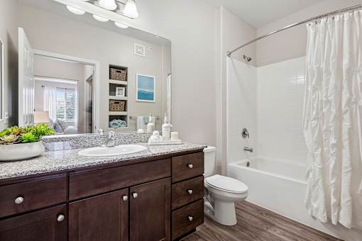 Wood-style flooring in bathrooms, kitchens and entryways - First and Main Apartments