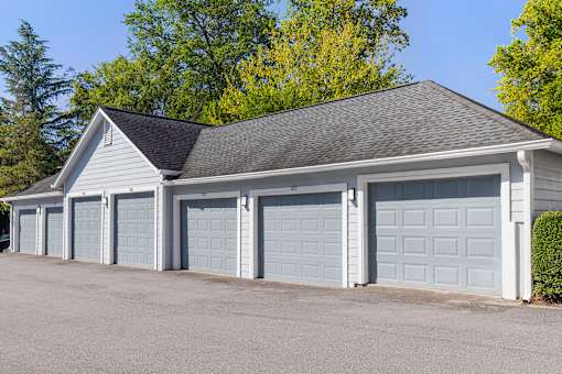 A two-car garage with a grey roof and white walls.