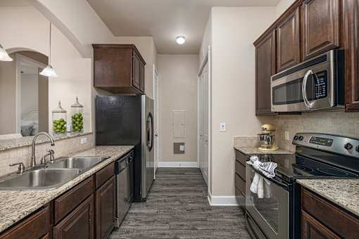 Granite countertops with  mosaic backsplash - Monterra Las Colinas Apartments
