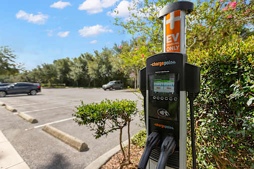 A ChargePoint EV charging station is located in a parking lot.