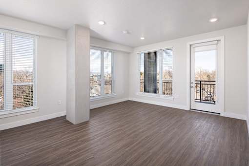 A room with wooden floors and white walls.