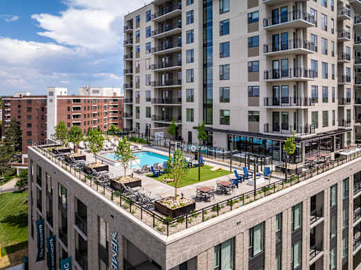 A large building with a pool in the middle of it.