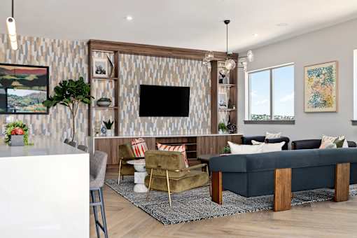 A living room with a television, a sofa, and a coffee table.