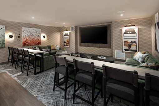 A conference room with a long table and chairs.