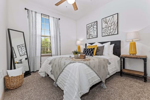 a bedroom with a large bed and a window