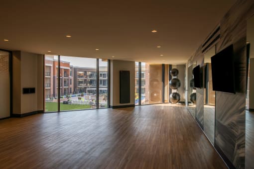 empty studio space with large windows and hardwood floors at The Apex at CityPlace, Overland Park, KS, 66210