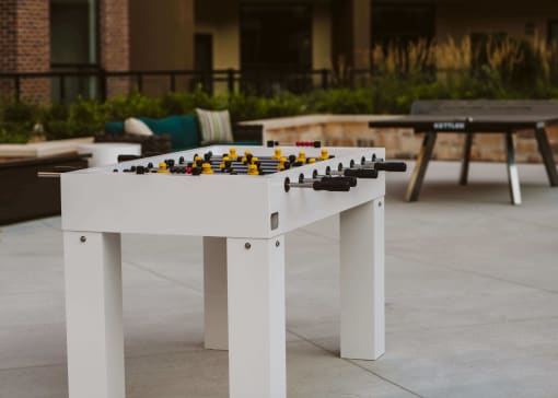 a foosball table on an outdoor patio at The Apex at CityPlace, Kansas
