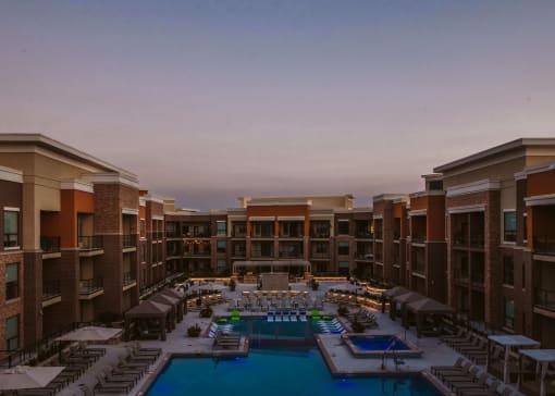 birds eye view of a large apartment complex and outdoor pool with seating at The Apex at CityPlace, Overland Park, 66210