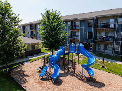 A Playground With a Blue Slide at Capitol Grove Apartments, Des Moines, Iowa