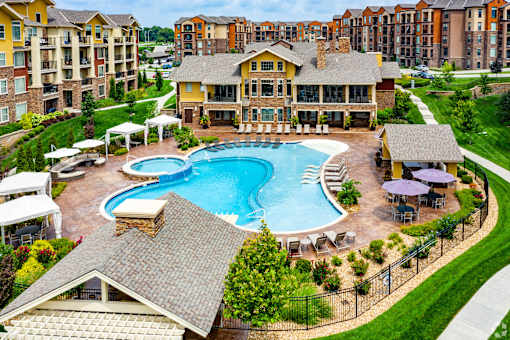 A large house with a pool in the middle of it.