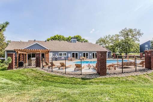 A house with a pool and a covered patio.