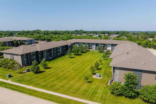 A Building With Spacious Lawn at Capitol Grove Apartments, Des Moines, Iowa