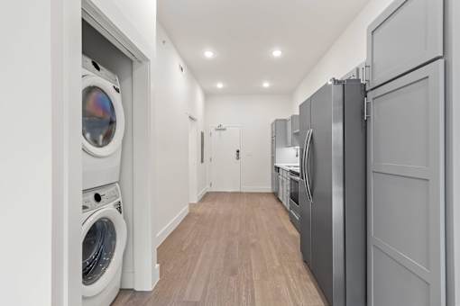 A laundry room with a washer and dryer in it.