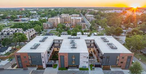 A sunset view of a modern apartment complex.