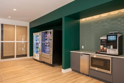 Summer Kitchen with Coffee Machine and Vending Machines in Overland Park Apartments