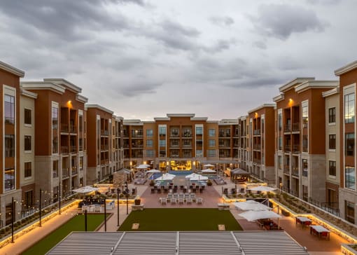 Sunset with perfect lighting at outdoor gaming terrace, pool deck, and grills at The Residences at Galleria, Overland Park, KS