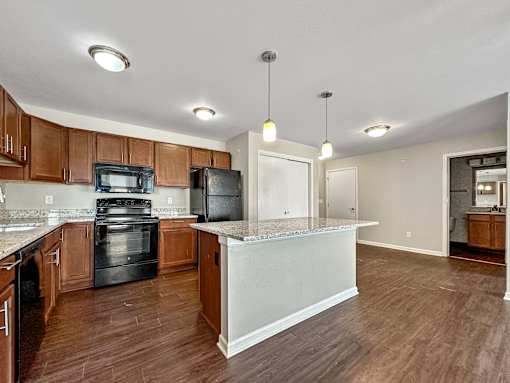 A Kitchen With a Black Oven at Capitol Grove Apartments, Iowa, 50317