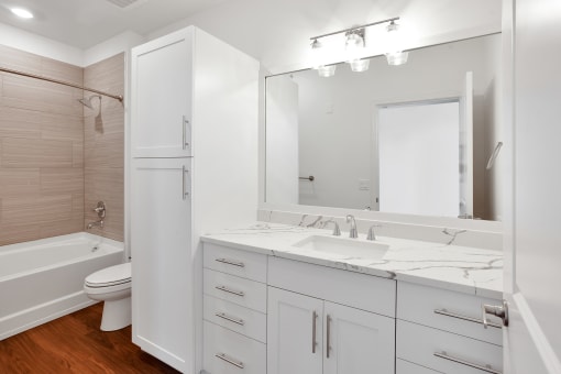 Bathroom with white cabinets at 44 Washington, Missouri