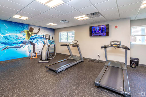 state of the art fitness center with exercise equipment apartments