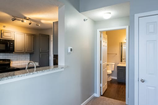 Open wall space with counter top from kitchen