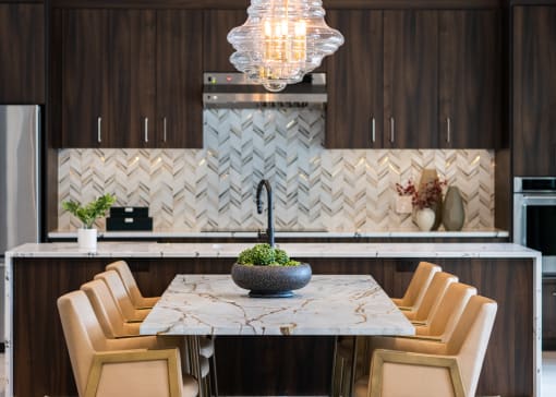 a kitchen with a marble table and chairs  at The Clearing at ONE28, Olathe, KS, 66062