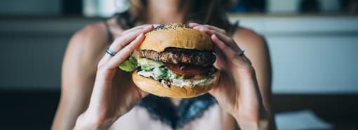 Woman Having A Burger at The Crest at Acworth, Georgia, 30102