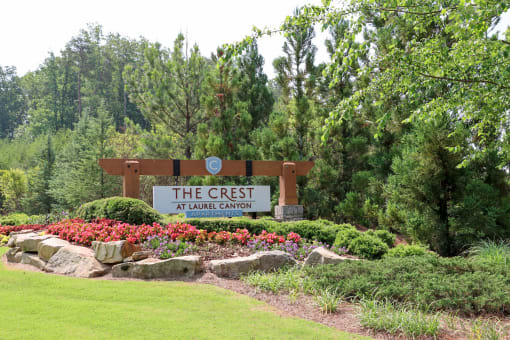 the entrance sign to the crest at upper canyon at The Crest at Laurel Canyon Apartments, Georgia, 30114
