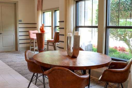 a dining room with a table and chairs at The Crest at Laurel Canyon Apartments, Canton, GA, 30114
