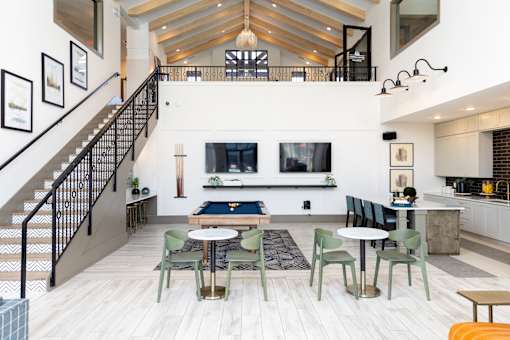 Community clubhouse with pool table and seating at The Crest at Acworth Apartments, Georgia