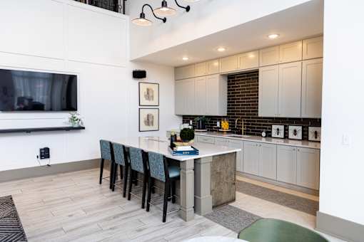 Open concept kitchen and living area with island seating at The Crest at Acworth Apartments, Georgia