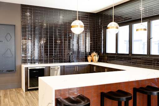Spacious airy kitchen with appliances installed at District on the Etowah Apartments, Canton, GA