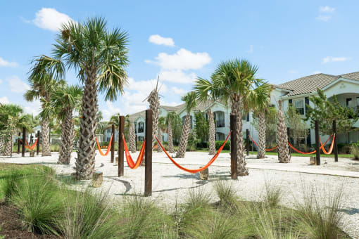 a hammock area in front of a row of houses at The Crest at Naples, Florida, 34113