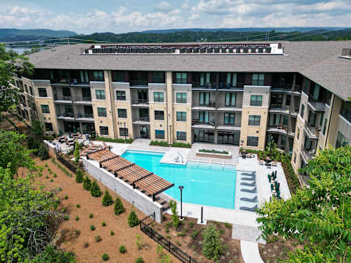 A large apartment complex with a pool.