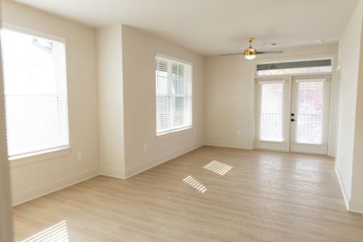 Calming neutral room with patterned flooring at District on the Etowah Apartments, Canton, GA 30114