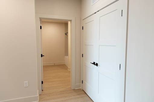 white door with right side of a hallway at District on the Etowah Apartments, Georgia, 30114
