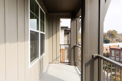 Stylish balcony with urban natural blend at District on the Etowah Apartments, Canton, GA 30114