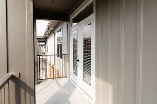 Stylish balcony with side window view at District on the Etowah Apartments, Canton, GA 30114