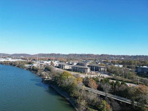 A river flows through a city with a bridge crossing over it.at Riverside Apartments, Chattanooga, TN