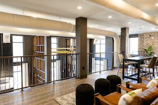 modern living room with a dining area and a balcony at District on the Etowah Apartments, Georgia