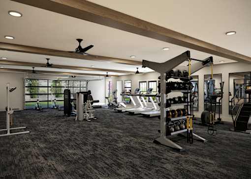 A spacious gym with a variety of equipment including treadmills, weights, and exercise machines.