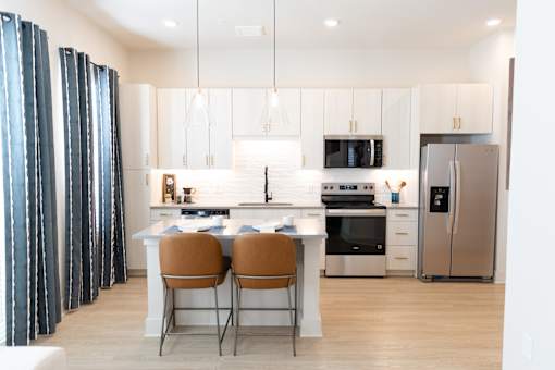 Cozy modern kitchen with Dinning table at District on the Etowah Apartments, Canton, GA 30114