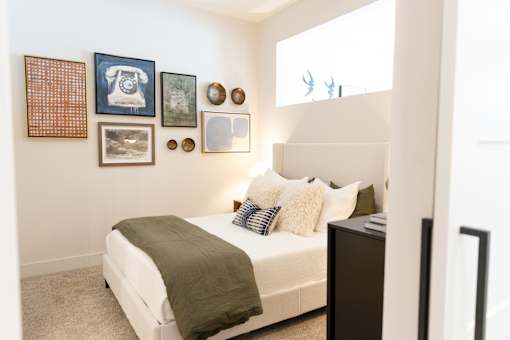 bedroom with a bed, nightstand at District on the Etowah Apartments, Georgia, 30114