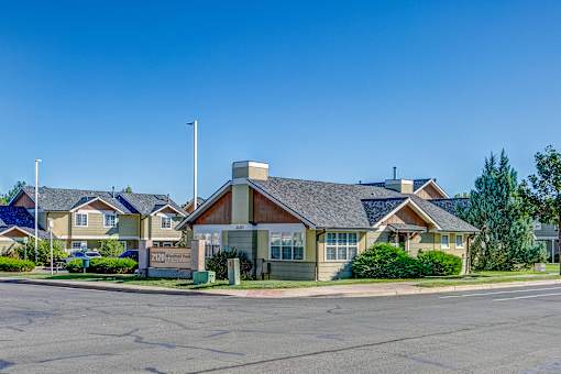 a row of houses on the corner of a street